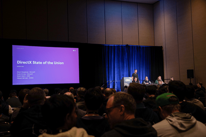 Microsoft presenters on stage at a GDC session.