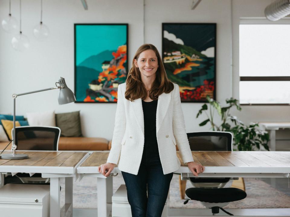 Lily Lyman, a partner at Underscore, poses for a photo inside the firm's trendy office at the Old State House in Boston.