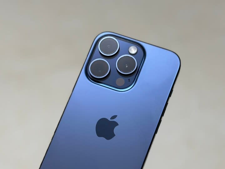 The back of a blue iPhone 15 Pro.