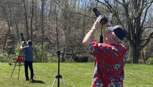 Steve Dubovich (left) and Alan Boyle (right) work with their cameras in advance of the total solar eclipse in Nashville, Ind. (Photo Courtesy of Dave Boyle)