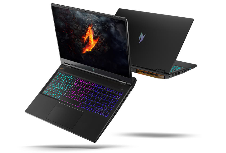 Product marketing image of the Acer Nitro 14 gaming laptop. Two models float dramatically in the air: one facing forward with its screen and keyboard visible, the other (behind it) showing a back view. Grayish-blue background.