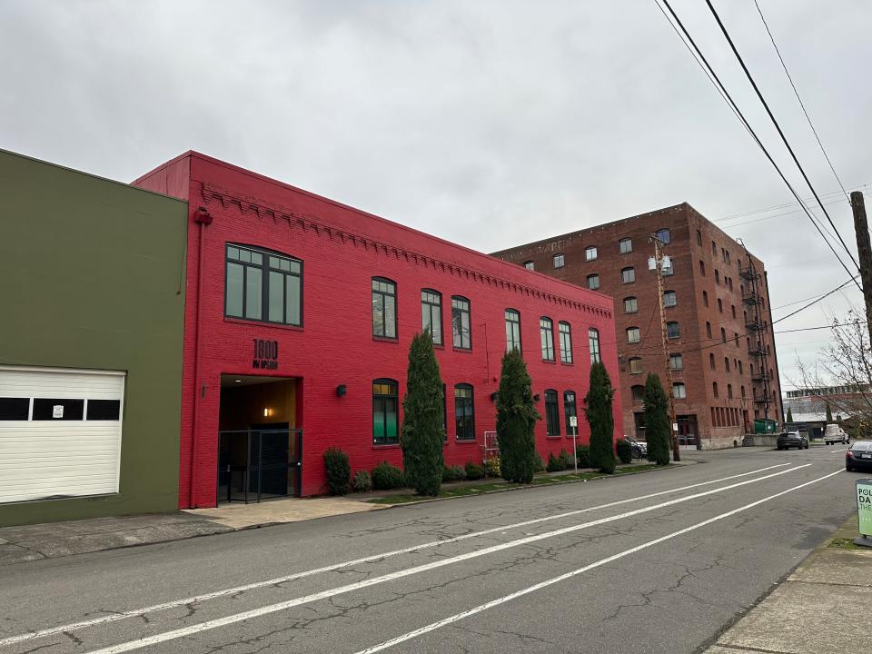 Allbirds' office, a red building on a city street in Portland, Oregon.