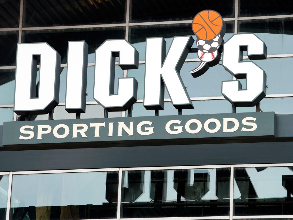 A logo for Dick's Sporting Goods on the side of a building.