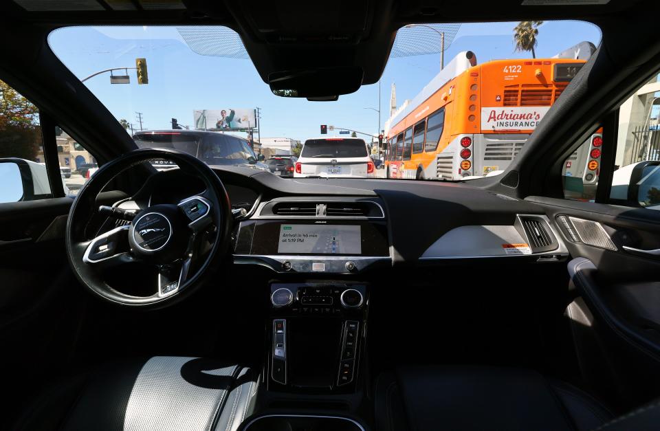 A self-driving Waymo makes its way through Los Angeles.