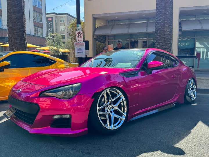Hot pink Subaru.