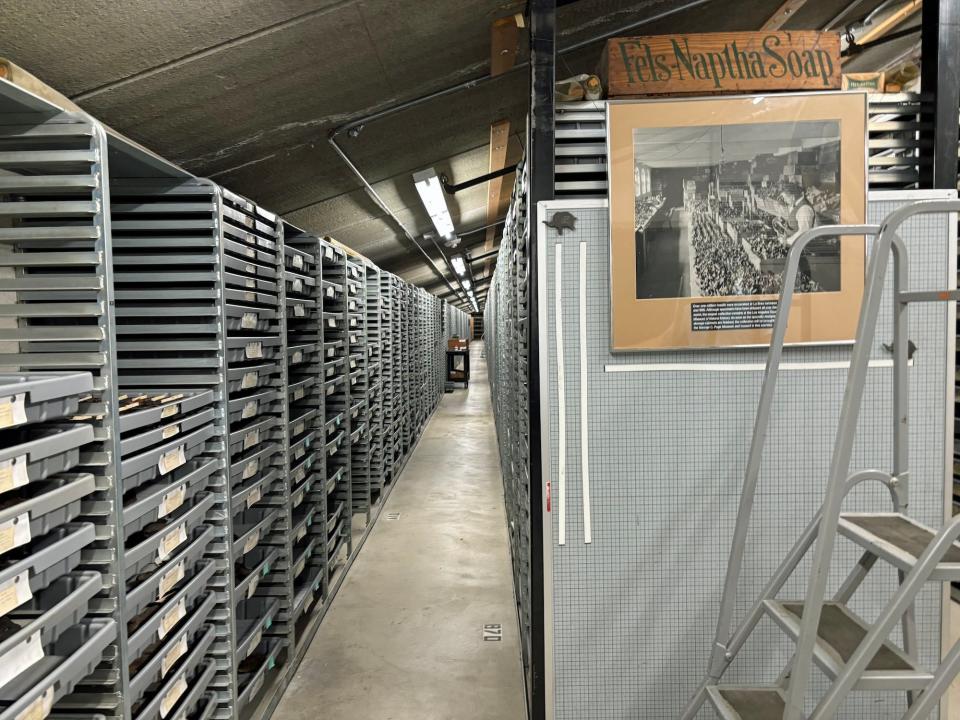 A very long row of shelves of trays of fossils in the La Brea musuem