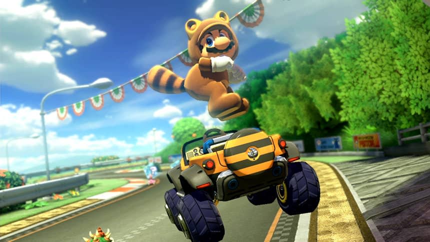 Mario in his Tanooki (racoon-like) suit, jumping in the air and sticking his ass out above his striped off-roader.
