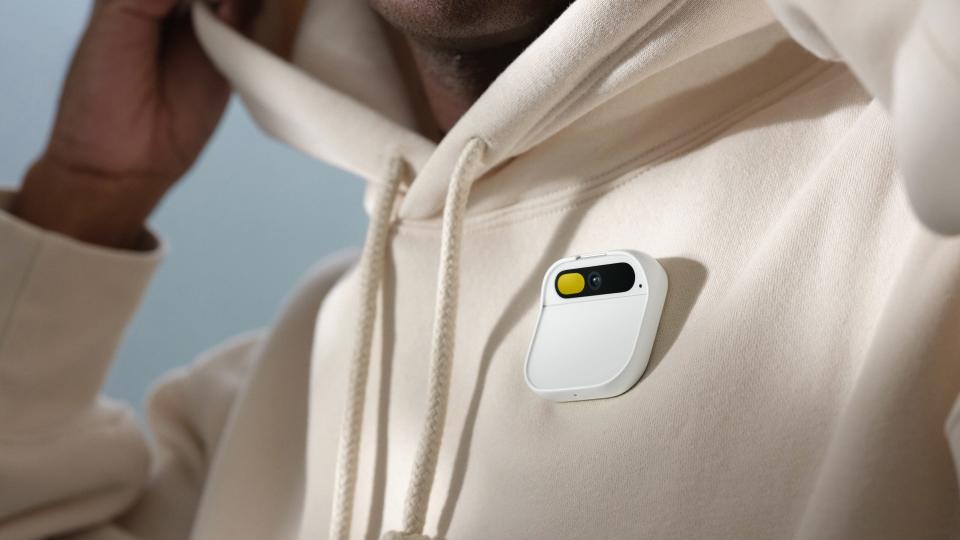 humane's Ai pin attached to a white sweatshirt