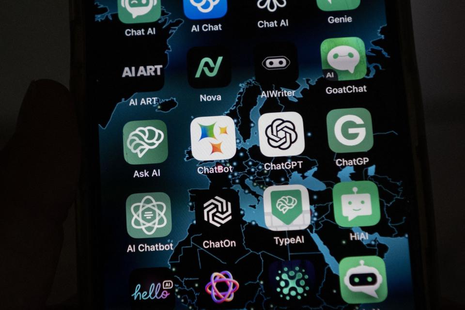 This illustration picture shows icons of Google's AI (Artificial Intelligence) app BardAI (or ChatBot) (C-L), OpenAI's app ChatGPT (C-R) and other AI apps on a smartphone screen in Oslo, on July 12, 2023.