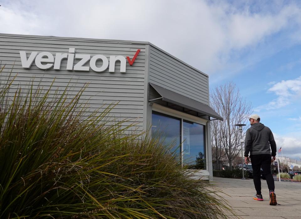A person walks by a Verizon store on Jan. 23, 2024 in Corte Madera, California.