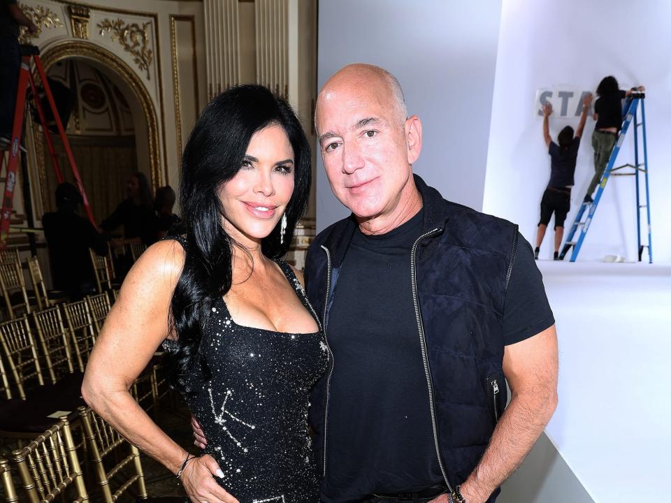 Lauren Sanchez and Jeff Bezos attend the Staud fashion show in September 2023.