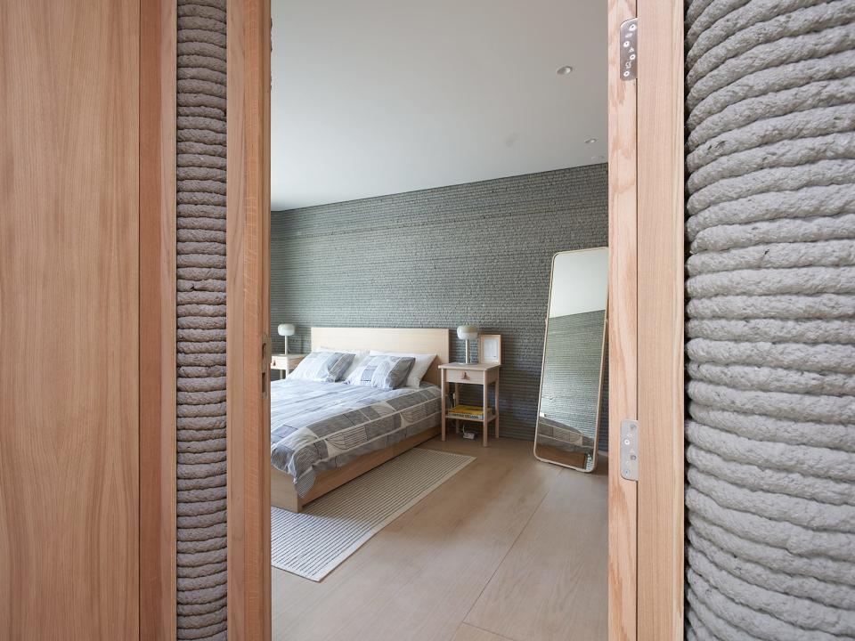 bedroom inside a 3d printed home 